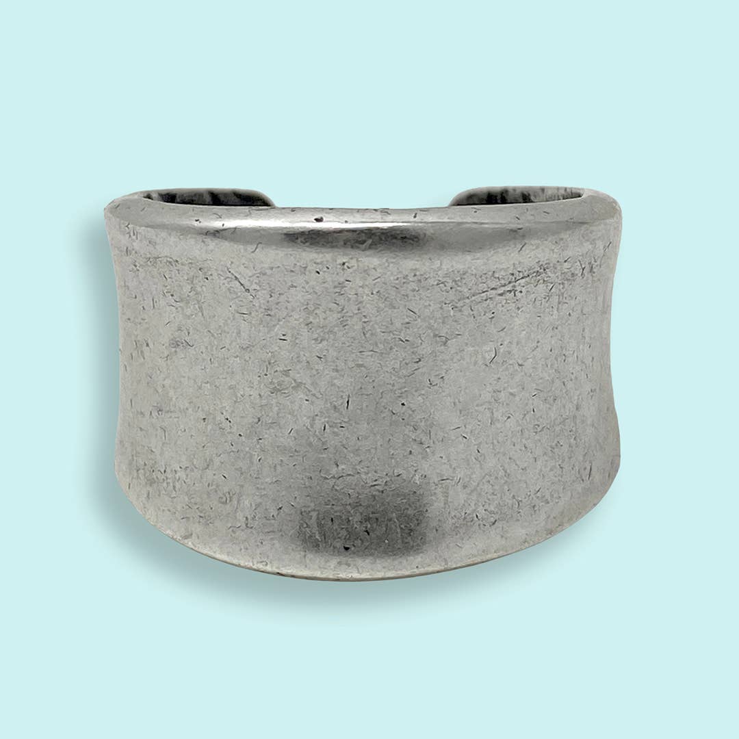 Silver ring on a light blue background