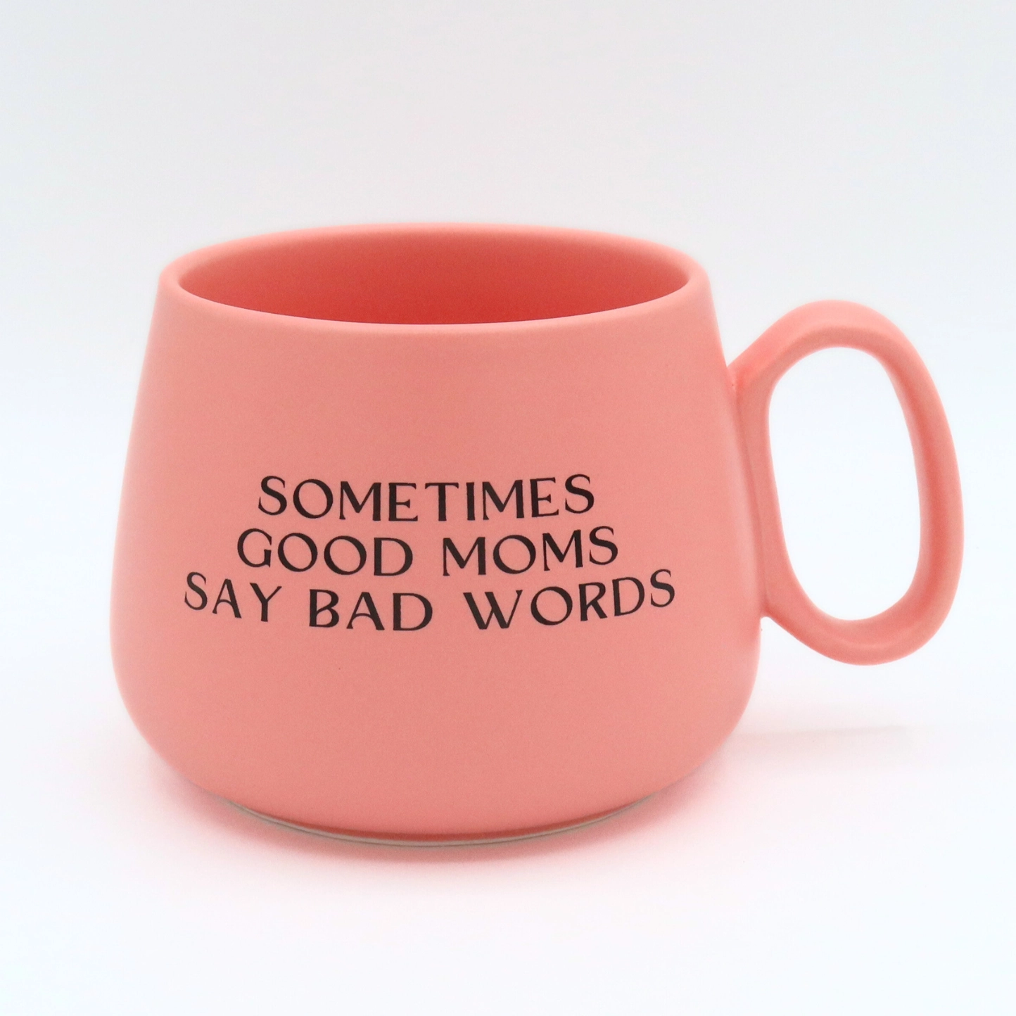 Pink mug with text 'Sometimes good moms say bad words' on a white background