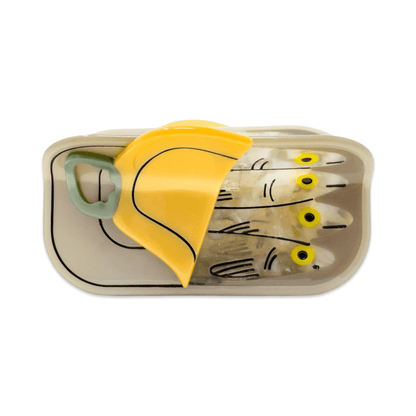 Set of fishing lures in a container with a yellow cover on a white background