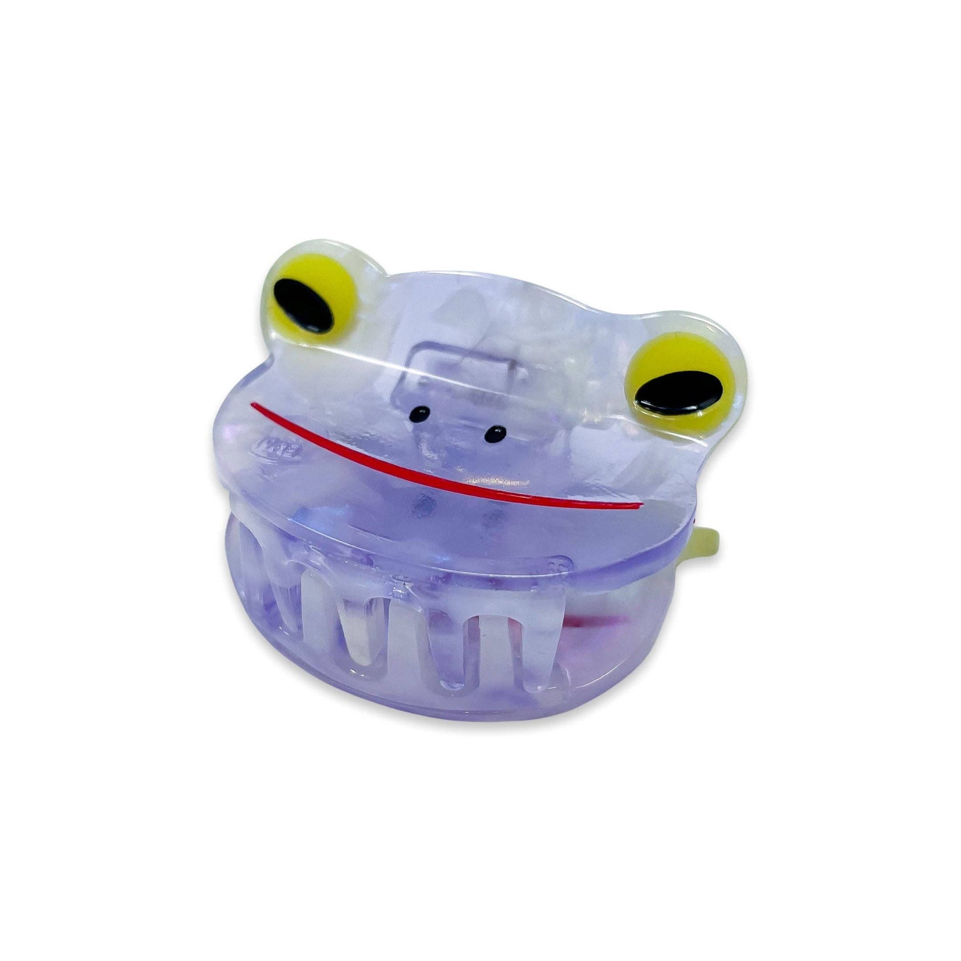 Clear plastic frog-shaped container with yellow eyes on a white background