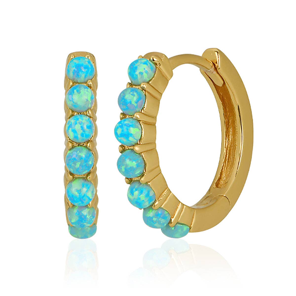 Gold hoop earrings with blue opal stones on a white background
