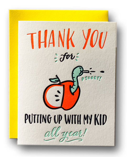 Card with a cartoon apple and worm illustration and text on a yellow envelope.