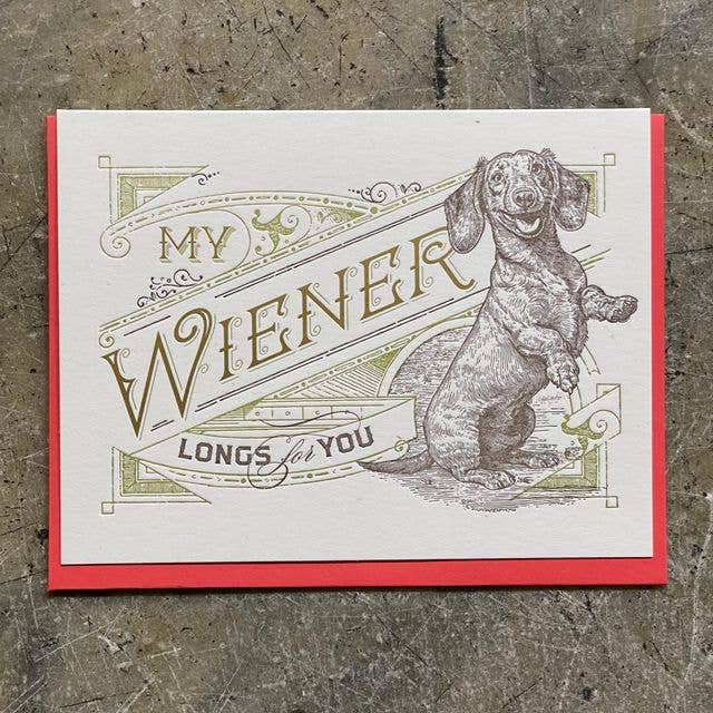 Card with a dachshund illustration and text on a textured surface