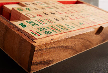 Wooden Mahjong board with tiles partially visible