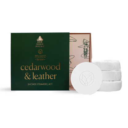 Musee cedarwood & leather shower steamers with packaging on a white background