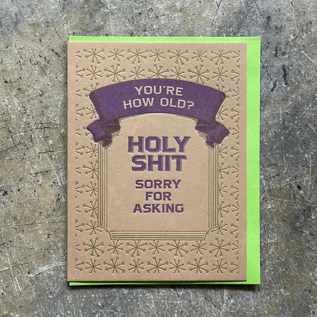 Card with humorous text on a textured surface