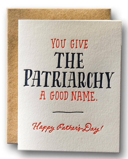 Card with text 'You give the patriarchy a good name. Happy Father's Day!' on a beige background with brown envelope.