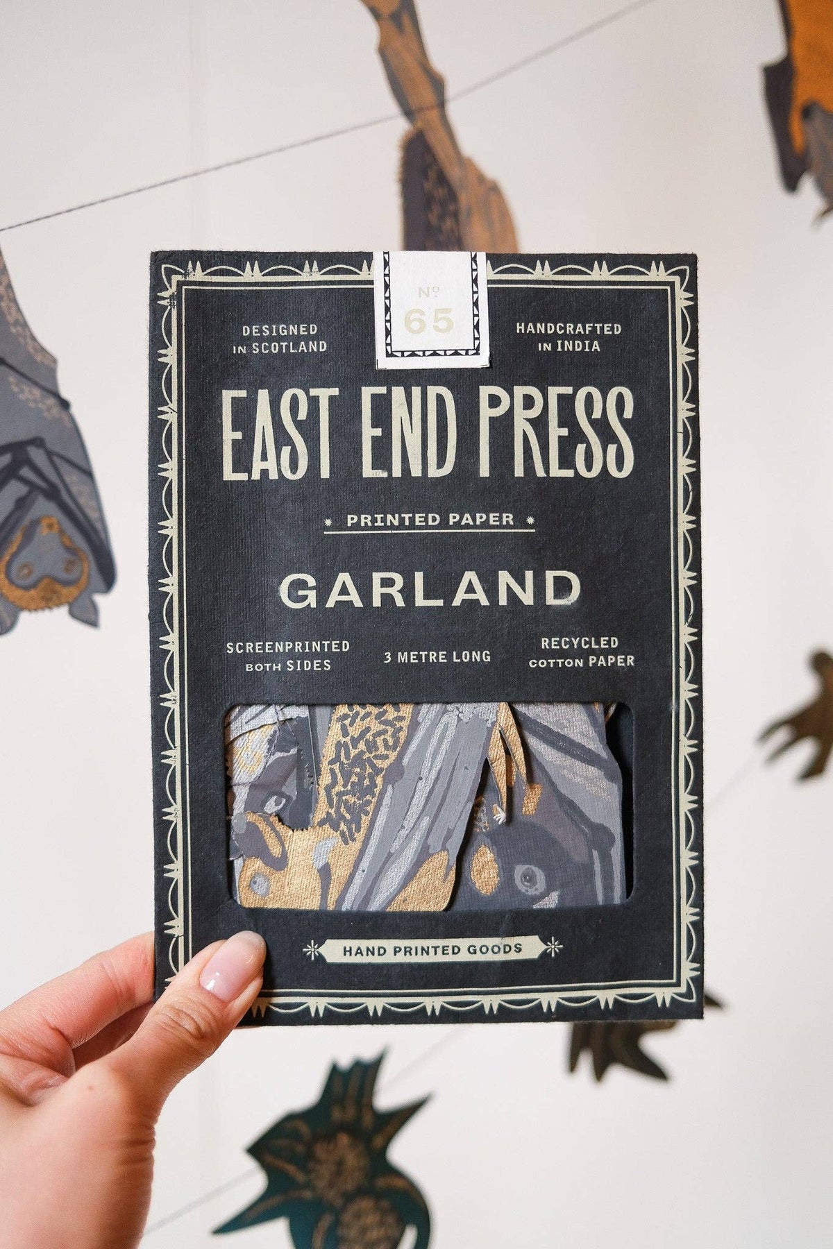 Packaged product from East End Press with decorative elements on a light background