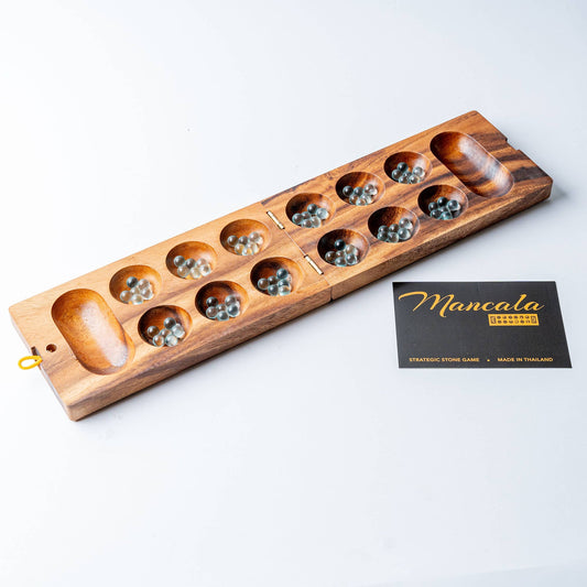 Wooden mancala game set on a white background with a card labeled 'Mancala'.