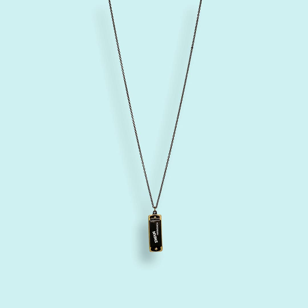 Necklace with a pendant on a light blue background