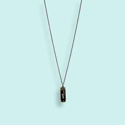 Necklace with a pendant on a light blue background