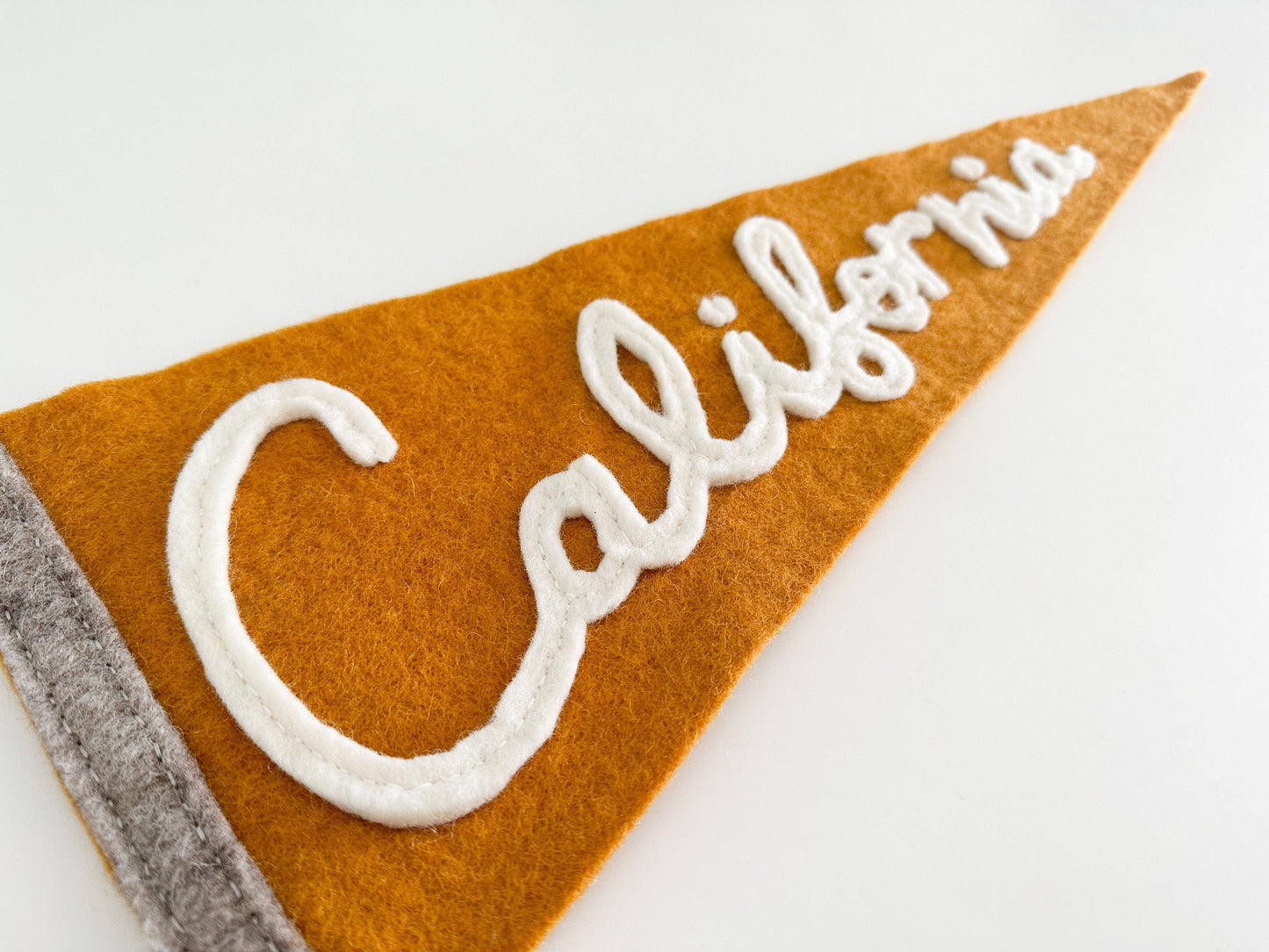 Felt pennant with 'California' text on a white background