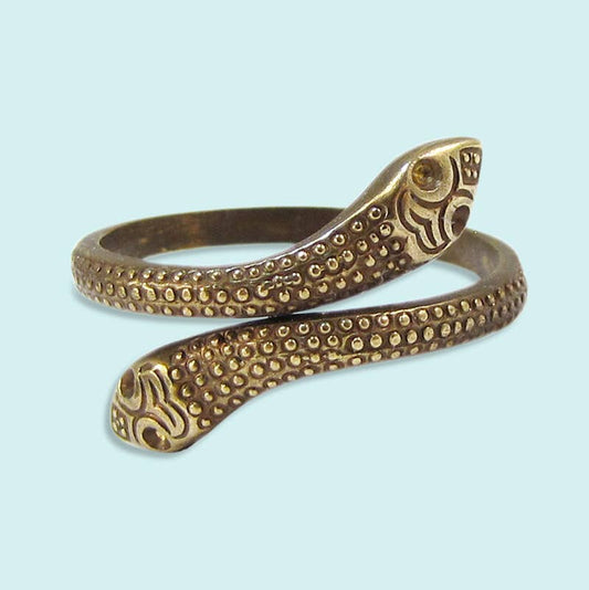 Bronze snake-shaped bracelet on a light blue background