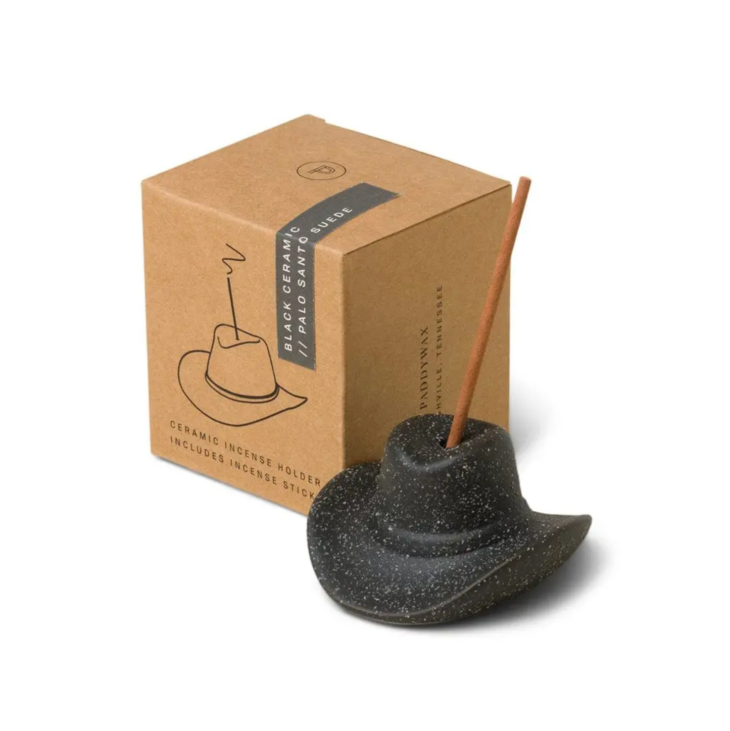 Ceramic incense holder shaped like a cowboy hat with an incense stick, next to a cardboard box on a white background.