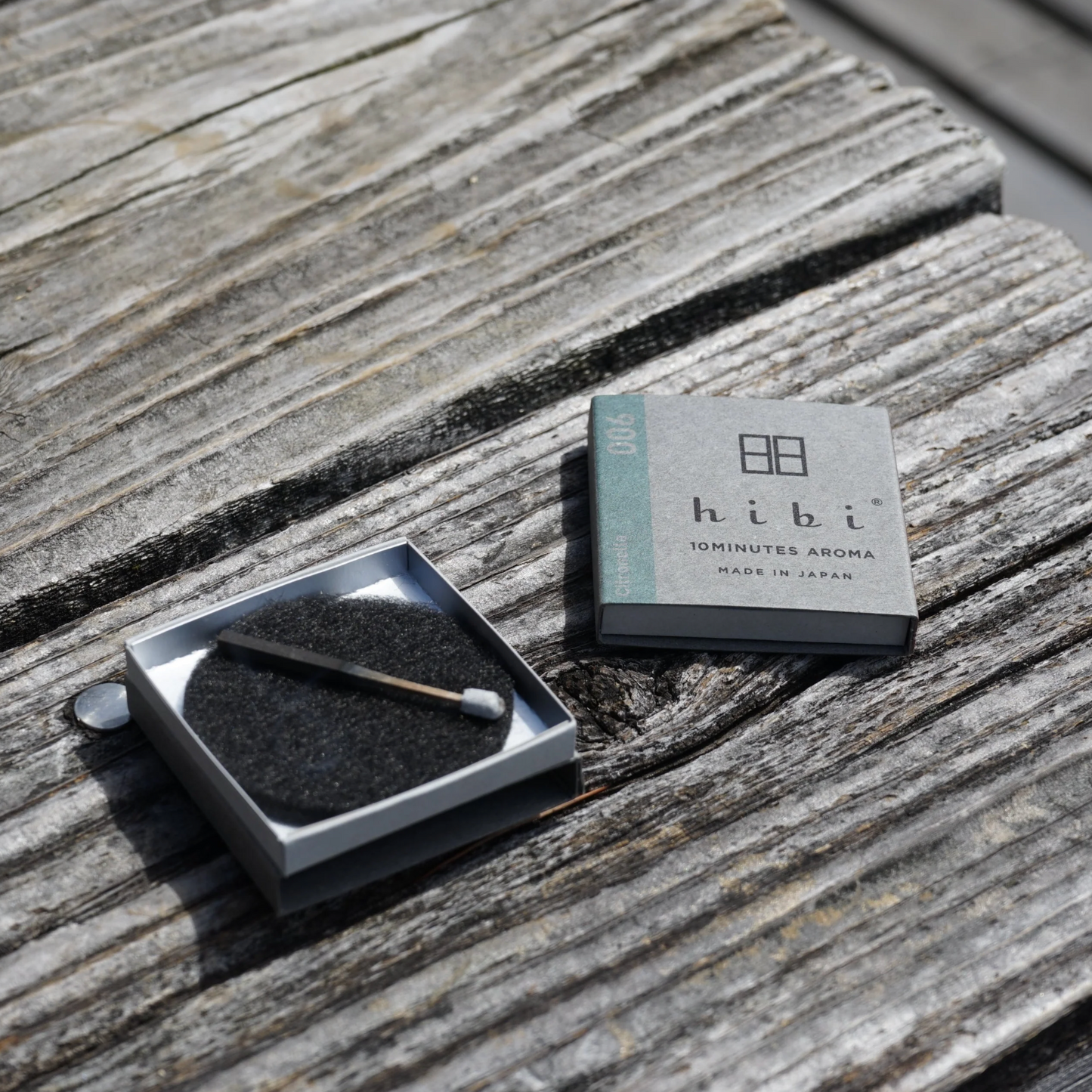 Hibi incense packaging on a wooden surface