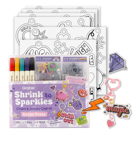 Shrink to Sparkles charm and jewelry craft kit with shrinky dinks and markers on a white background