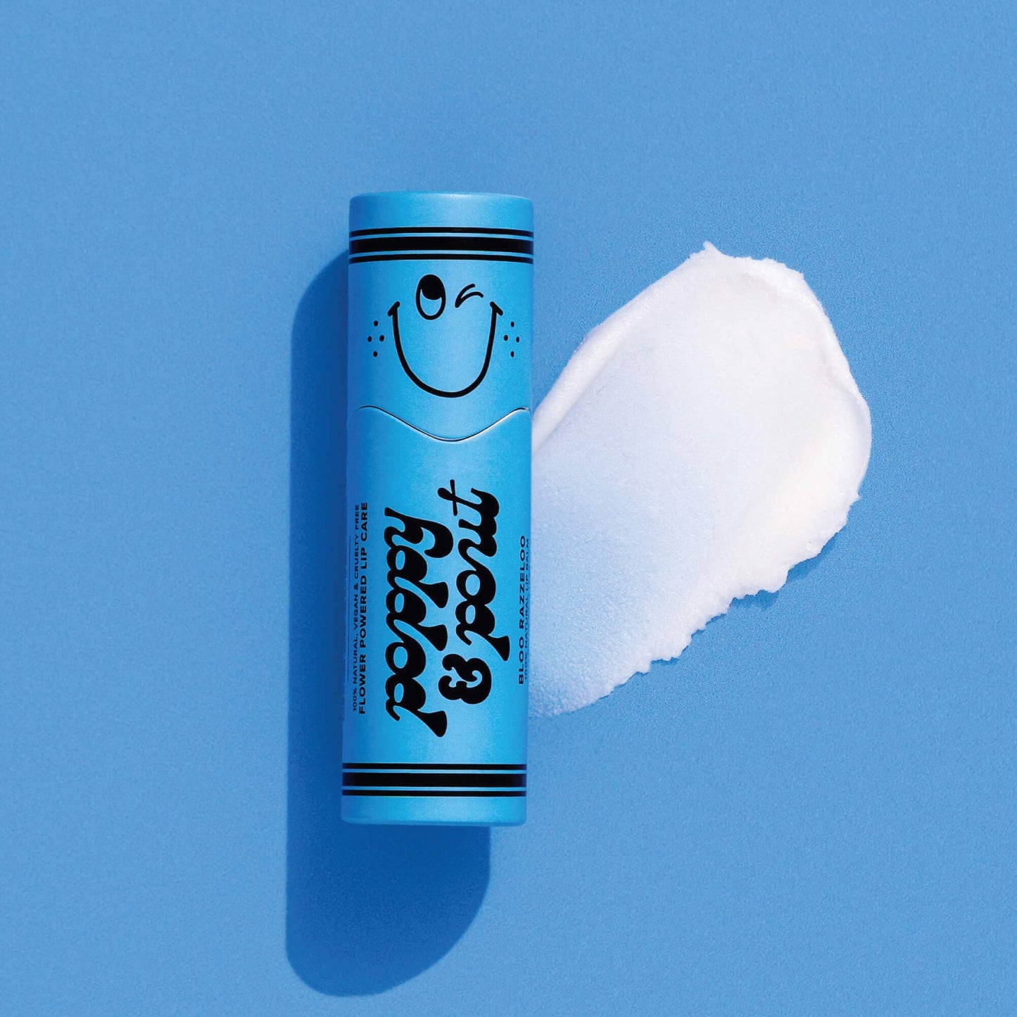 Blue tube of lip balm with a smiley face on a blue background