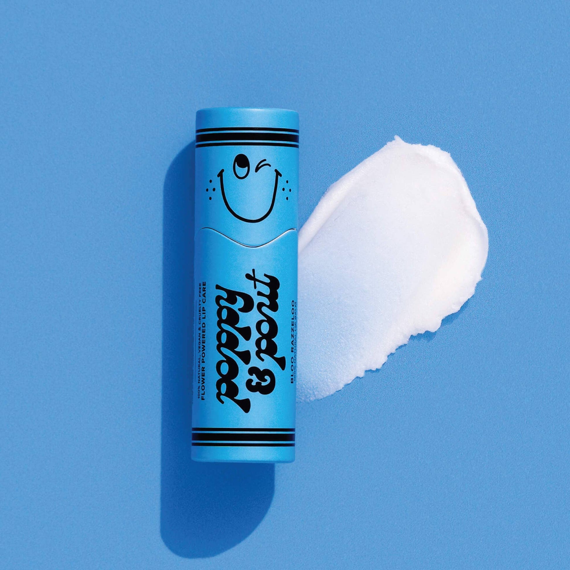 Blue tube of lip balm with a smiley face on a blue background