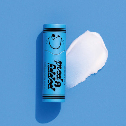 Blue tube of lip balm with a smiley face on a blue background