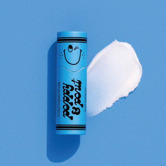 Blue tube of lip balm with a smiley face on a blue background