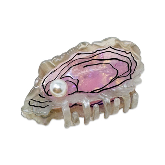 Shell with a pink interior and pearl on a white background