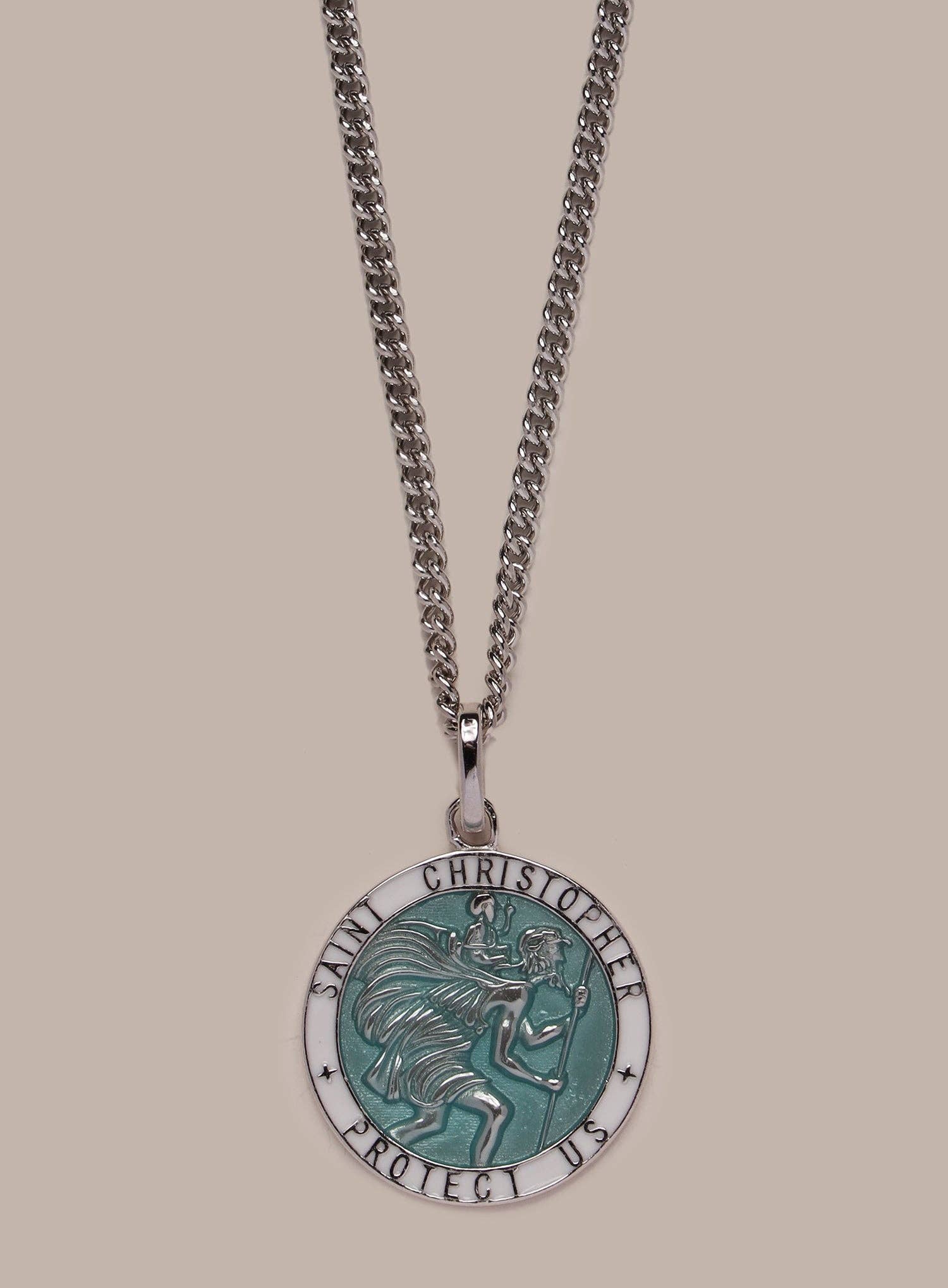 Necklace with a Saint Christopher pendant on a beige background