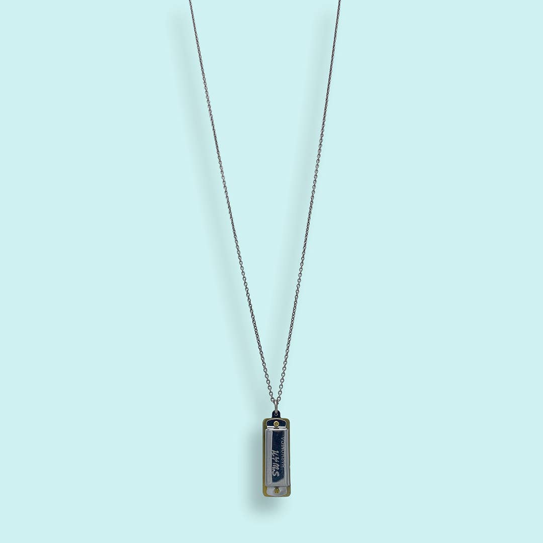 Necklace with a rectangular pendant on a light blue background