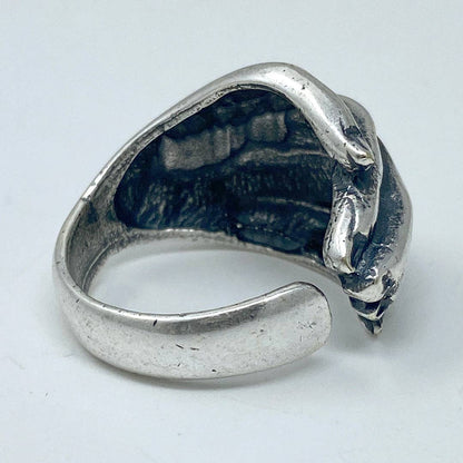 Silver ring on a light gray background