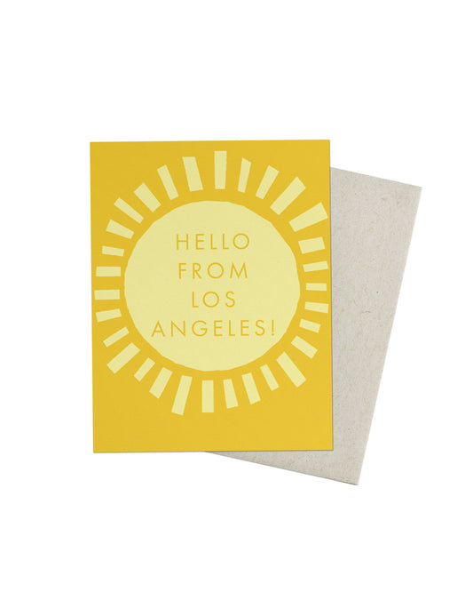 Greeting card with sun design and 'Hello from Los Angeles!' text on a yellow background