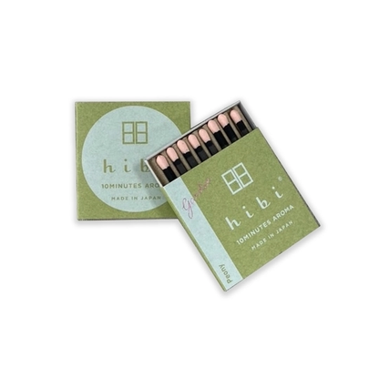 Open matchbox with matches and closed lid displaying 'hibi' branding on a white background
