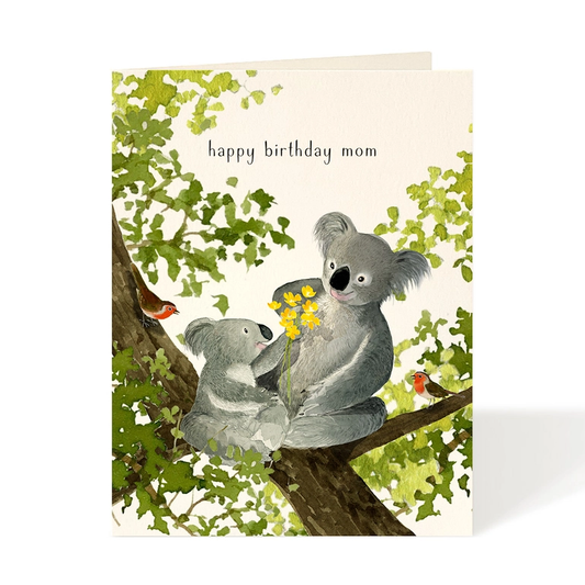 Greeting card with two koalas on a branch and 'happy birthday mom' text.