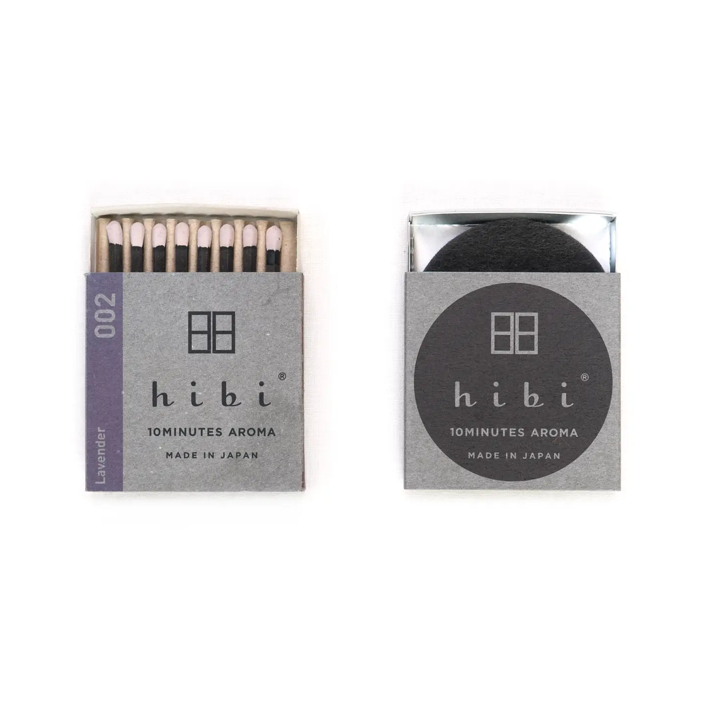 Two boxes of hibi matches on a white background