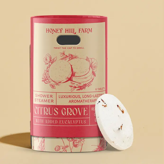 Honey Hill Farm Citrus Grove shower steamer on a beige background