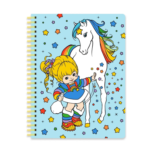 Notebook with a colorful illustration of a girl and unicorn on a blue background