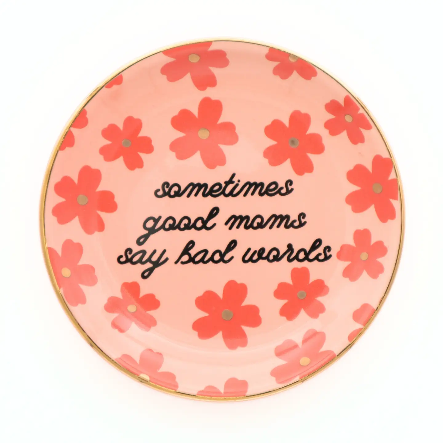 Round pink plate with floral design and text 'sometimes good moms say bad words' on a white background