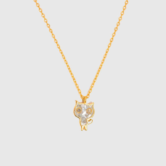Gold cat-shaped pendant necklace on a light gray background