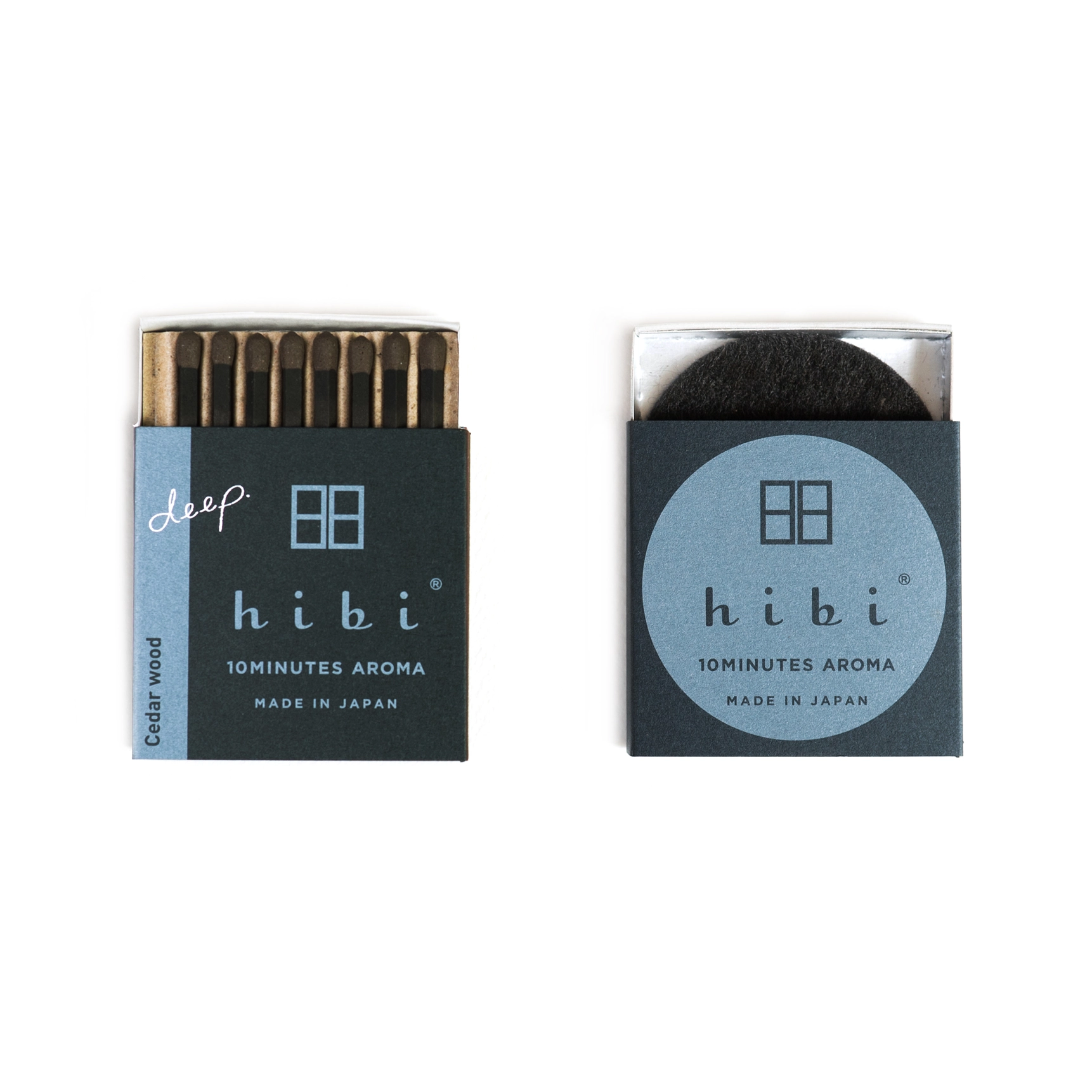 Two boxes of hibi incense sticks on a white background