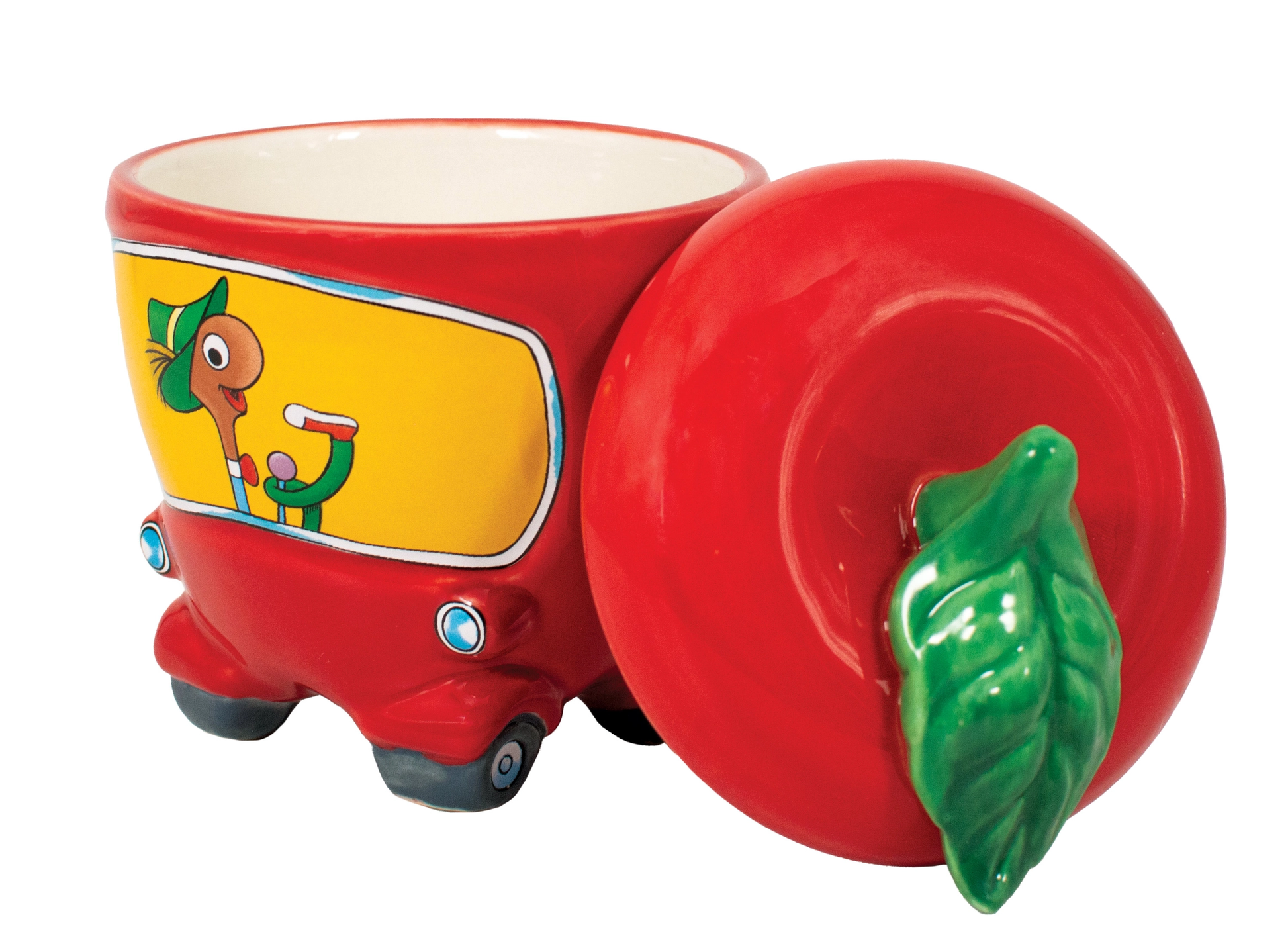 Red ceramic mug with a cartoon character on a yellow background, featuring a green leaf handle.
